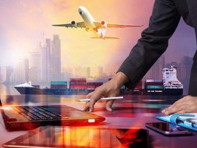 businessman working with Container Cargo ship and Cargo plane with big city  in seaport , logistic import export background and transport industry.